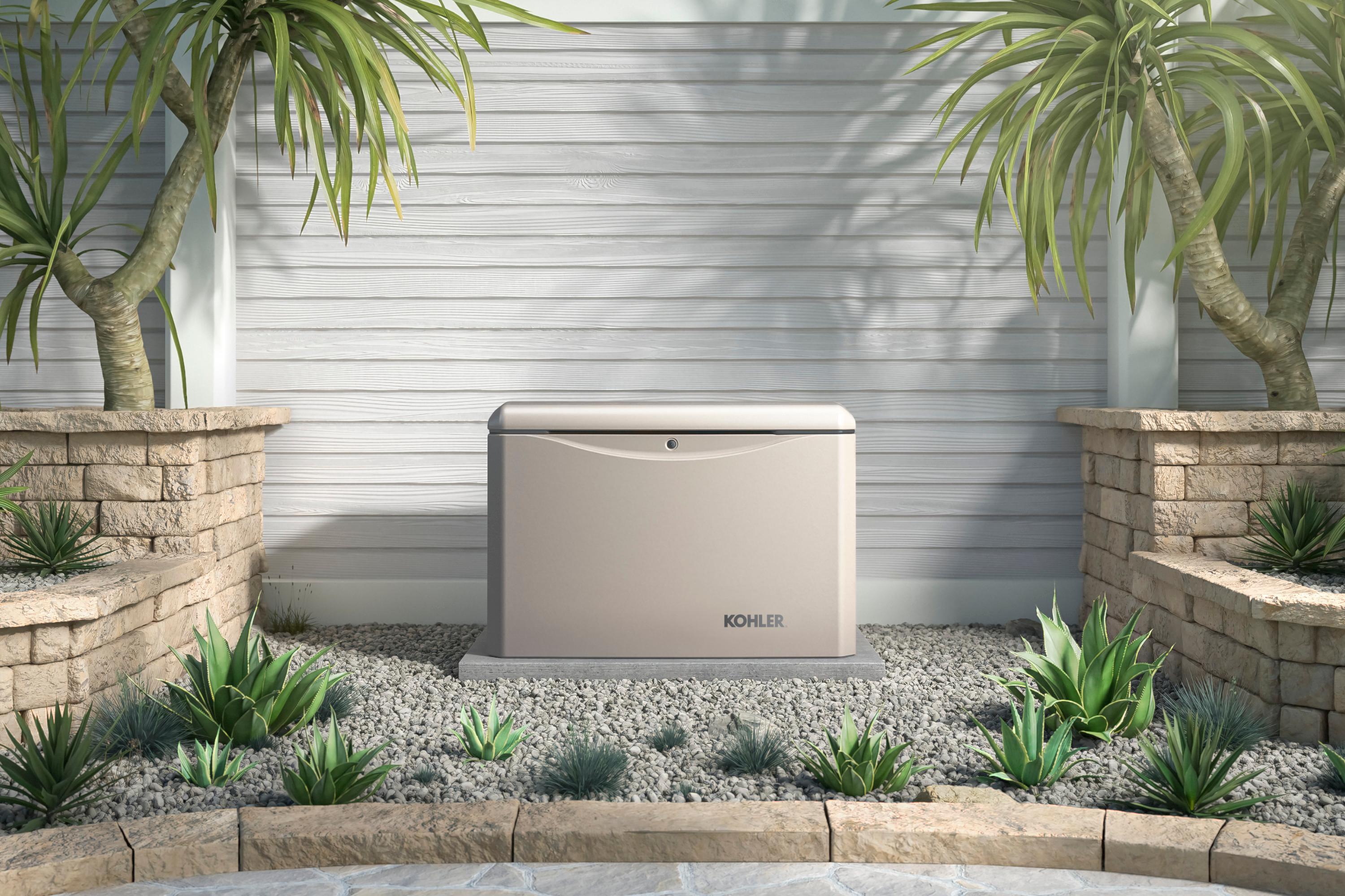 Home generator installed in a stone and gravel patio outside a home against a wood paneled wall in a light light lifestyle scene.